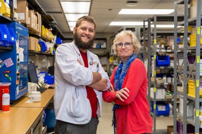 Kyle Eberstein and Donna Kadlec pose in the pharmacy at the Veterinary Teaching Hospital.