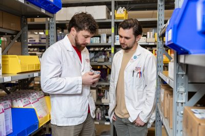 Brandon Willis and Logan Gillenwater working in the pharmacy at the Veterinary Teaching Hospital. 
