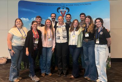 Group of conference attendees posing for a picture.